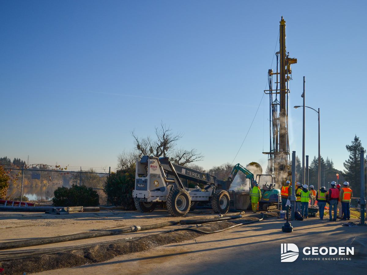 Jet grouting drill rig with its crew working on a levee